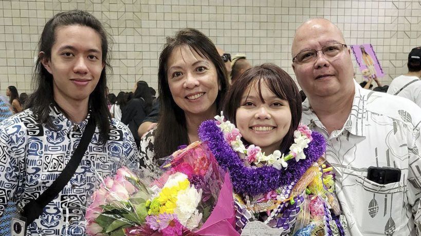 In this photo provided by Vernon Tyau, Jarek Agcaoili, left, with his mother Danielle, sister Jessika and father Maury Agcaoili pose in May 2023, at Jessika's high school graduation in Hawaii. Danielle and Maury Agcaoili were among boaters who died Sunday, May 28, 2023, near Sitka, Alaska, when a fishing vessel ran into trouble in rough seas. (Vernon Tyau via AP)